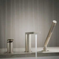 Deck-mount bath faucet with handshower