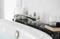Deck-mount bath spout with flare design