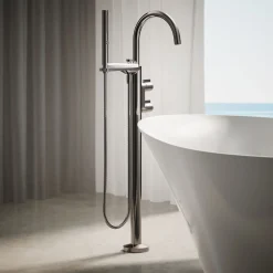 Floor-mount bath filler trim with lever handles and handshower