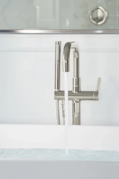 Floor-mount bath filler trim with handshower