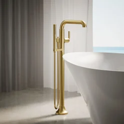 Floor-mount bath filler trim with handshower