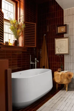 Floor-mount bath filler trim with handshower
