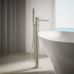 Floor-mount bath filler trim with handshower