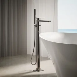 Floor-mount bath filler trim with handshower