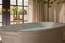 Floor-mount bath filler trim with handshower