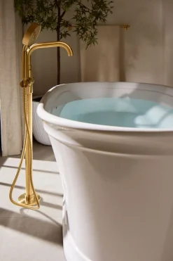 Floor-mount bath filler trim with handshower