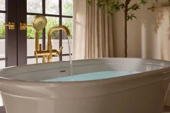 Floor-mount bath filler trim with handshower