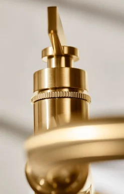 Floor-mount bath filler trim with handshower