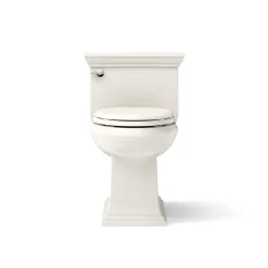 One-piece compact elongated toilet with skirted trapway, 1.28 gpf