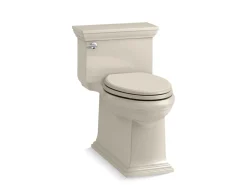 One-piece compact elongated toilet with skirted trapway, 1.28 gpf
