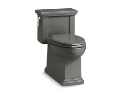 One-piece compact elongated toilet with skirted trapway, 1.28 gpf