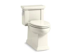One-piece compact elongated toilet with skirted trapway, 1.28 gpf