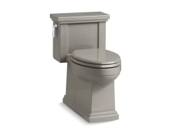 One-piece compact elongated toilet with skirted trapway, 1.28 gpf