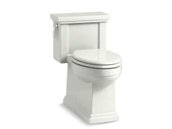 One-piece compact elongated toilet with skirted trapway, 1.28 gpf