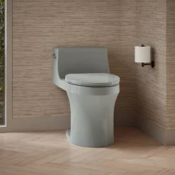 One-piece compact elongated toilet with concealed trapway, 1.28 gpf