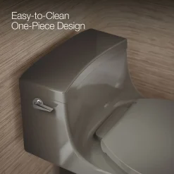One-piece compact elongated toilet with concealed trapway, 1.28 gpf