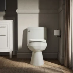 One-piece elongated toilet with concealed trapway, 1.28 gpf