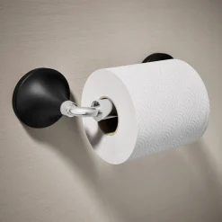 Pivoting toilet paper holder