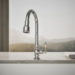 Pull-down kitchen sink faucet with three-function sprayhead