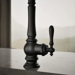Pull-down kitchen sink faucet with three-function sprayhead