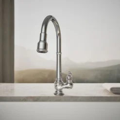 Pull-down kitchen sink faucet with three-function sprayhead