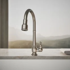 Pull-down kitchen sink faucet with three-function sprayhead