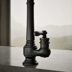 Pull-down kitchen sink faucet with three-function sprayhead