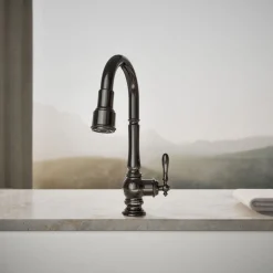 Pull-down kitchen sink faucet with three-function sprayhead