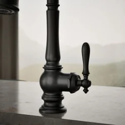 Pull-down kitchen sink faucet with three-function sprayhead