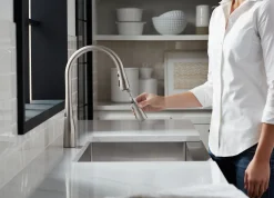Pull-down kitchen sink faucet with three-function sprayhead