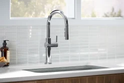 Pull-down kitchen sink faucet with three-function sprayhead