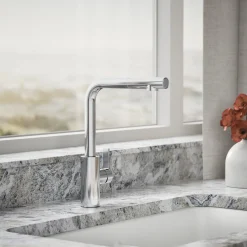 Pull-out kitchen sink faucet with two-function sprayhead