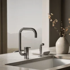 Single-handle kitchen sink faucet with two-function extended-reach spout and side sprayer