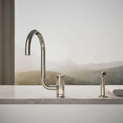 Single-handle kitchen sink faucet with two-function extended-reach spout and side sprayer