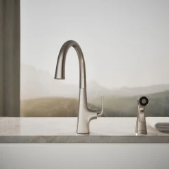 Single-handle kitchen sink faucet with two-function side sprayer