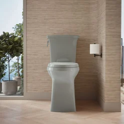 Tall ContinuousClean two-piece elongated toilet with skirted trapway, 1.28 gpf