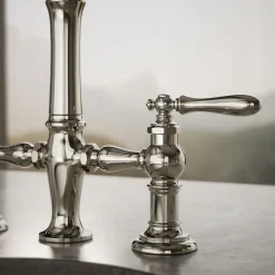 Three-hole bridge bar sink faucet with side sprayer