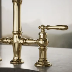 Three-hole bridge bar sink faucet with side sprayer