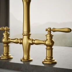 Three-hole bridge kitchen sink faucet with side sprayer