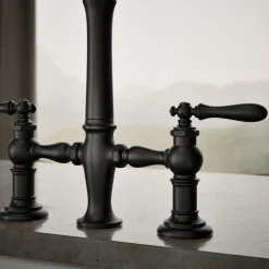Three-hole bridge kitchen sink faucet with side sprayer