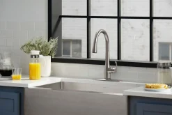 Touchless pull-down kitchen sink faucet with three-function sprayhead