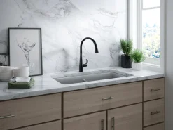 Touchless pull-down kitchen sink faucet with three-function sprayhead