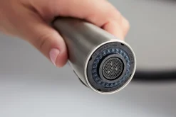 Touchless pull-down kitchen sink faucet with three-function sprayhead