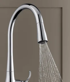Touchless pull-down kitchen sink faucet with three-function sprayhead