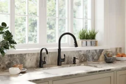 Touchless pull-down kitchen sink faucet with three-function sprayhead