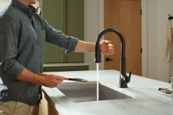 Touchless pull-down kitchen sink faucet with three-function sprayhead