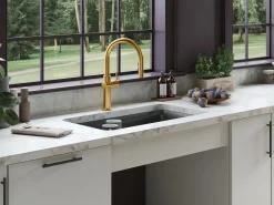 Touchless pull-down kitchen sink faucet with three-function sprayhead