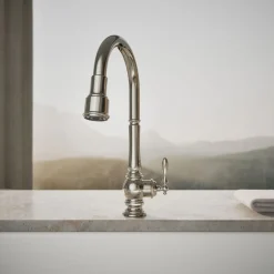 Touchless pull-down kitchen sink faucet with three-function sprayhead