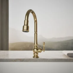 Touchless pull-down kitchen sink faucet with three-function sprayhead