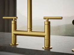 Two-hole bridge kitchen sink faucet with side sprayer